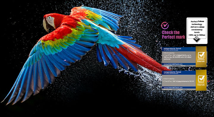 Colorful parrot in ultra-high definition against a black background. Water drops are suspended in the air all around it. The image showcases Perfect Color as each different hue on the parrot's body is vibrant and vivid. Different logo certifications from UL and Intertek are visible. These refer to 100% Color Fidelity and 100% Color Volume. Text is also visible, check the Perfect Color certification mark.