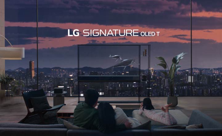Whales swim up against a left corner of LG SIGNATURE OLED T as the water level lowers to reveal the transparent screen. The frame zooms out to show LG SIGNATURE OLED T standing in the foyer in front of people sitting on the couch as the whales continue to swim across the transparent screen revealing a city skyline against an evening sky.