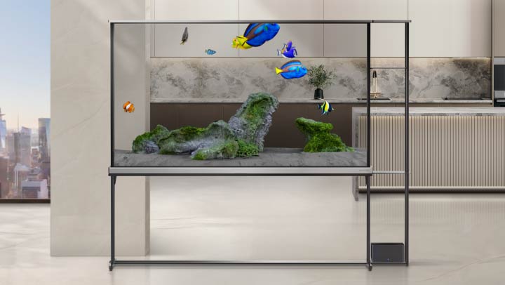 LG SIGNATURE OLED T screen shows T-Home then switches over to Always Ready where the T-Objet titled Aquarium is selected. An aquarium scene is depicted on the transparent screen of the LG Signature OLED T.