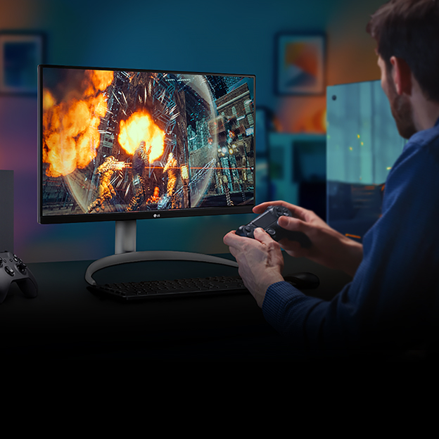 LG gaming monitor showing an action game with a player holding a controller illustrates VRR for smoother motion during gameplay.