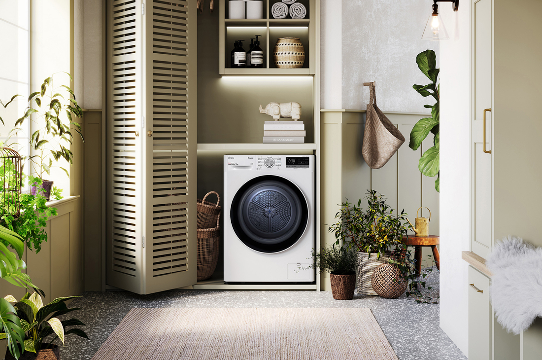 The white LG 9kg dryer FDV709W, featuring a distinctive black porthole ring, shown installed in a stylish, modern laundry closet.