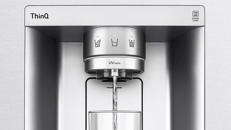 LG ThinQ water dispenser with UVnano technology, centred, dispensing water into a glass below.