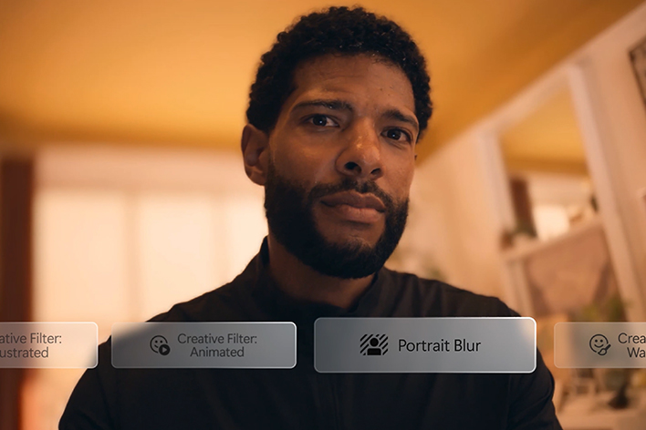 A man is looking at the screen, applying and switching between filters labeled "Creative Filter: Illustrated," "Creative Filter: Animated," and "Portrait Blur.