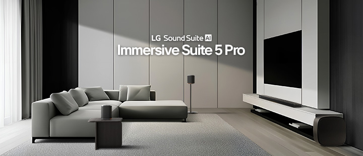 A living room with a TV and Sound Suite set, a soundbar, a pair of speakers beside the sofa and on a side table, and a woofer next to the TV.