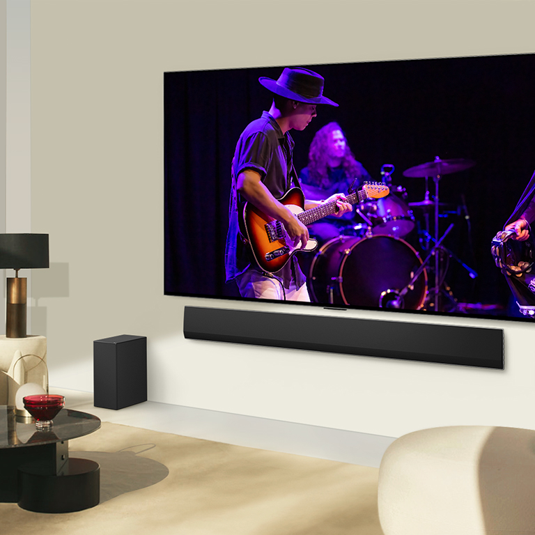 TV and soundbar matched together in a modern living space.