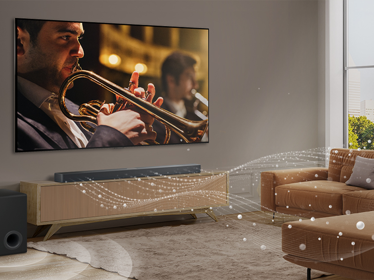LG Soundbar, LG TV, and a subwoofer are placed in a modern city apartment. LG Soundbar is emitting soundwaves made of white droplets filling the room and a subwoofer is creating a sound effect from the bottom. As a whole, they are creating a dome effect across the room.