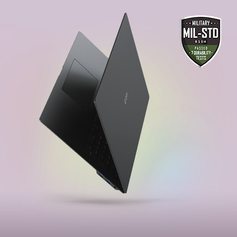 A sleek, partially open laptop with a minimalist design, showcased against a soft gradient background. The MIL-STD durability certification badge is prominently displayed in the top right corner, emphasising its slim, lightweight, yet durable build.