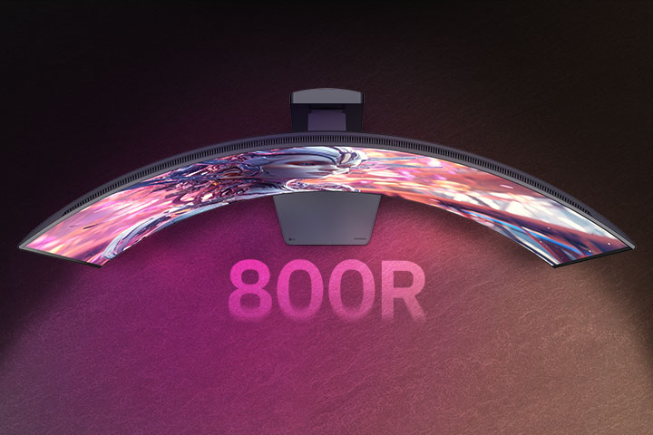 An animated video transitioning from a front view to a top view of a curved monitor.