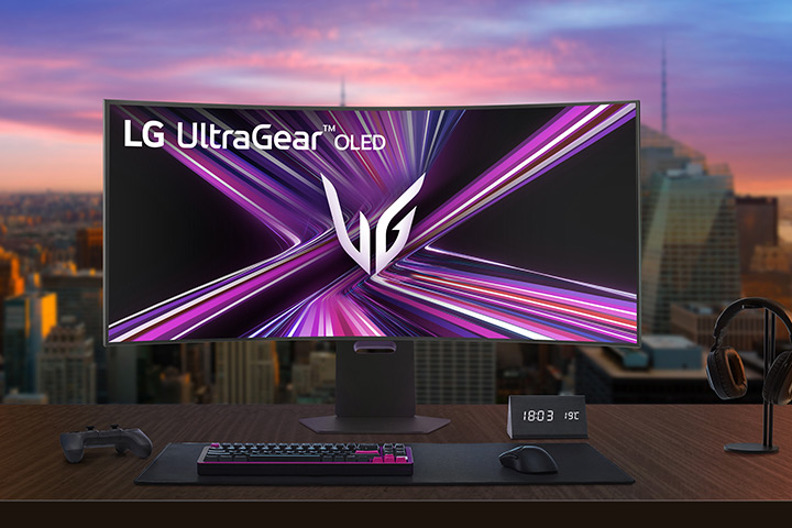LG UltraGear OLED monitor setup on a gaming desk in a modern room.	