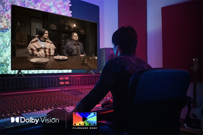 A director in front of a control panel editing the movie "Killers of the Flower Moon" on an LG QNED TV. In the bottom left, the Dolby Vision logo and FILMMAKER MODE™ logo.