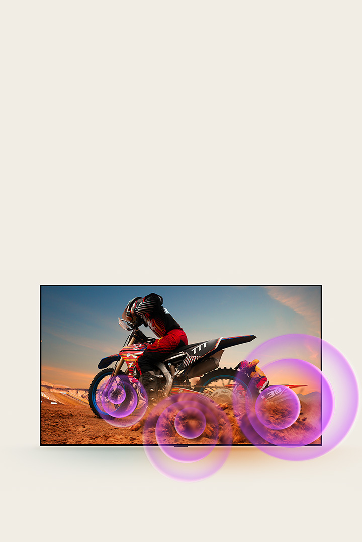 LG QNED TV depicts a man on a motorcycle with purple abstract circles coming out of the wheel to visualize sound emission.	