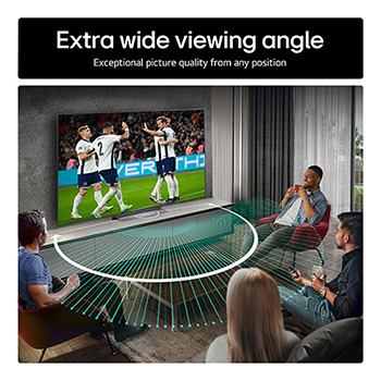 Living room space with a wall-mounted LG OLED TV. On the TV is a mountain range against a dark evening sky filled with stars. This scene is split in half. One side shows a duller, grayer version of the landscape labeled, Non Perfect Black display. On the other side is a more pleasing picture with a larger dynamic range of blacks and whites. 