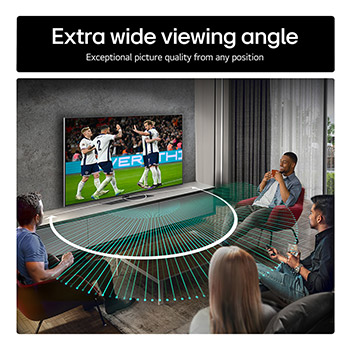 Living room space with a wall-mounted LG OLED TV. On the TV is a mountain range against a dark evening sky filled with stars. This scene is split in half. One side shows a duller, grayer version of the landscape labeled, Non Perfect Black display. On the other side is a more pleasing picture with a larger dynamic range of blacks and whites. 