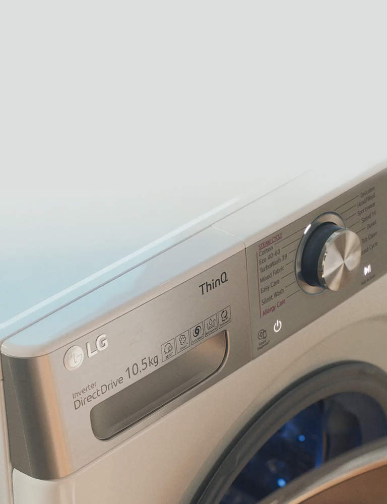 Women using the washing machine to care for her clothes.
