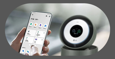 An image of the LG ThinQ app and an LG air purifier. On the left, a hand holds a smartphone operating the LG ThinQ app. The app screen displays 'Our Home | All,' showing four modes — Vacation, Sleep, Away, and Comfort — along with the status of four devices: Washing Machine (12:45 remaining), Air Purifier (Normal), Styler (06:24 remaining), and TV (On). At the bottom are buttons for Add Device and Smart Diagnosis. On the right, an LG air purifier with a circular display showing 10:20.