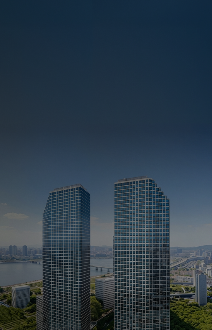 A background image displaying a wide view of the Han River and the downtown skyline under a clear sky. Positioned on the right side of the screen are the LG Twin Towers, consisting of two adjacent high-rise buildings with full glass facades.